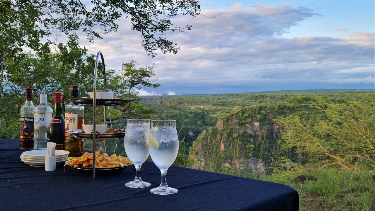 Sundowners overlooking the Batoka Gorge while staying at The Wallow